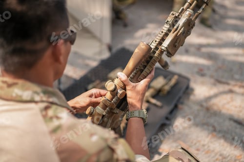 Preview: US Army Rangers with weapons. modern rifle on table, soldiers weapons concept