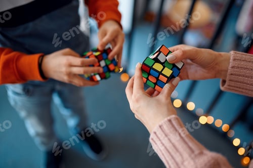 Preview: People play with puzzle cubes, intellectual rest