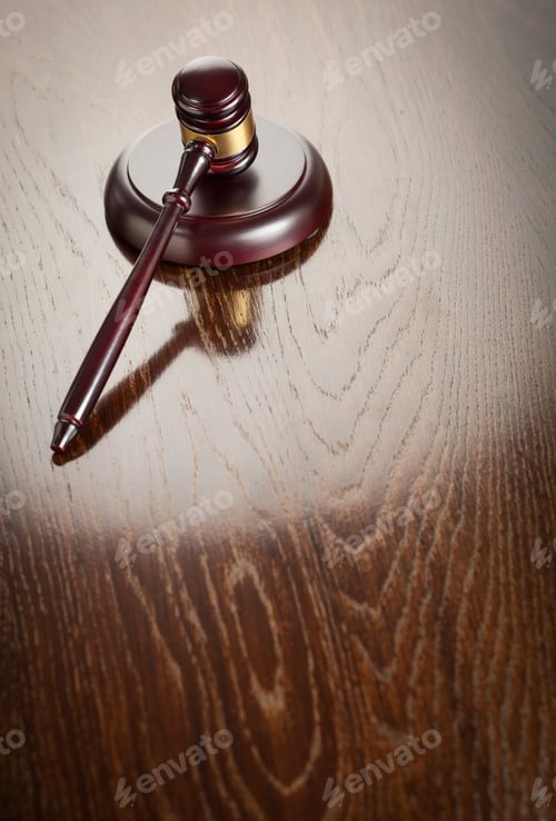 Preview: Dark Wooden Gavel Abstract on Reflective Table with Room for Text.
