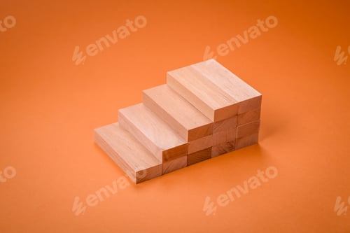 Preview: Wooden steps made of blocks as an idea of investment and profit growth in achieving a goal