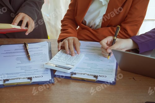 Preview: A group of lawyers and clients engage in a professional meeting law office, discussing agreements