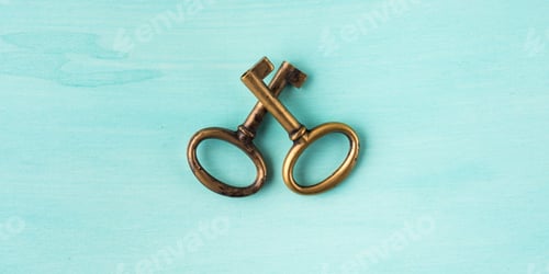 Preview: Two vintage brass keys on green pastel