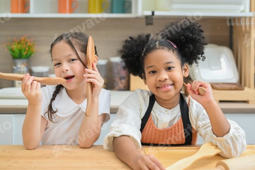 Preview: Two Girls Enjoying Time Playing in the Kitchen