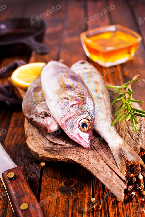 Preview: raw fish on wooden board