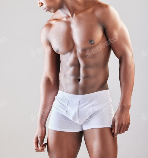 Preview: A different shade of glory. Cropped shot of a muscular man posing against a grey background.