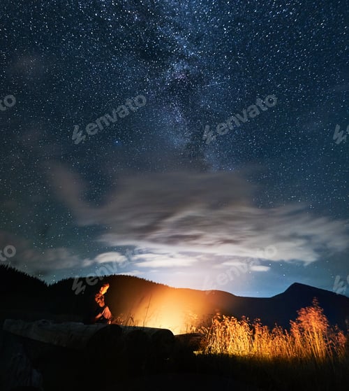 Preview: Man or woman enjoying starry sky on fresh air.
