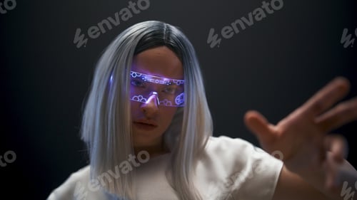Preview: Metaverse woman hand touching invisible videogame world closeup. Future concept