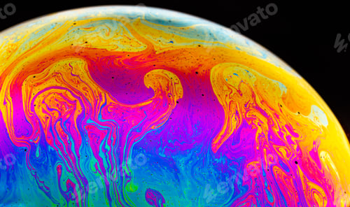 Preview: Rainbow soap bubble on a dark background. Close-up of colorful surface.