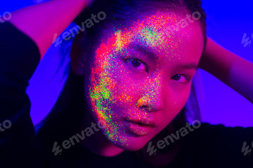 Preview: Fashion model with fluo painting on the face