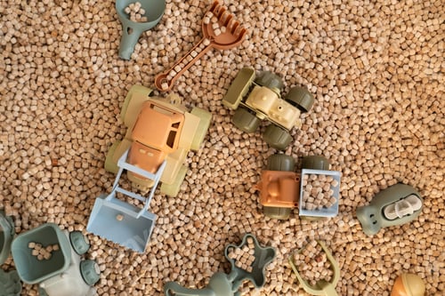 Preview: A modern children's sandbox with toys. Sandbox filler in the form of wooden small wooden cubes