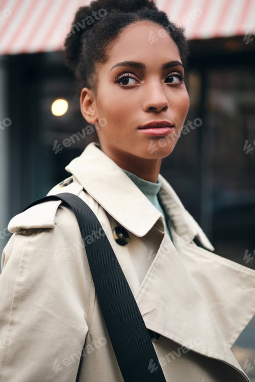 Preview: Stylish Woman in Trench Coat Walking in City