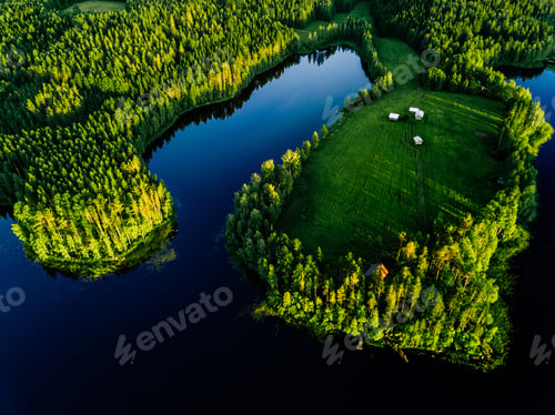 Preview: Aerial view of blue lakes and green forests on a sunny summer day in rural Finland.