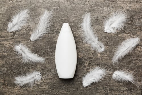 Preview: Spa cosmetic product, cream jar, branding mock up, top view with feathers background. Flat lay