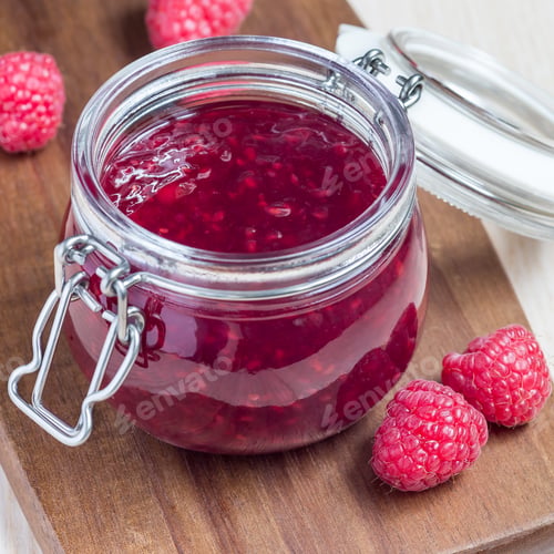 Preview: Raspberry jam in glass jar on wooden board, square format