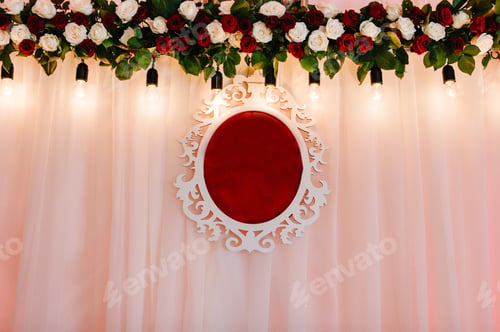 Preview: Arch, stands decorated with composition of red flowers and greenery in the banquet hall. The banquet