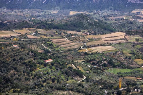 Preview: Farms and green fields with Mountain Landscape Background. Dorgali, Sardinia, Italy.
