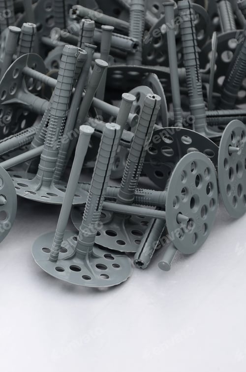 Preview: Background of many gray plastic dowels (fastening) for thermal insulation