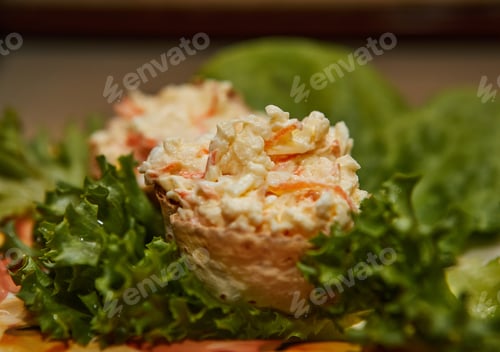Preview: Delicious Homemade Salad with Crab Sticks and Fresh Lettuce on Marble Tray
