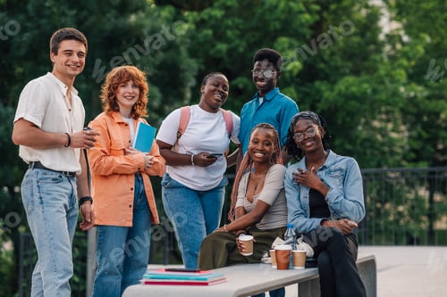 Preview: Portrait of diverse college students taking a coffee break at campus.
