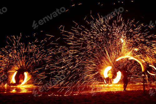 Preview: some very pretty light emihing from the fire show by some guys