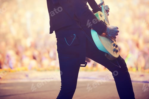 Preview: Awesome power chords. Cropped shot of a guitarist performing on stage.