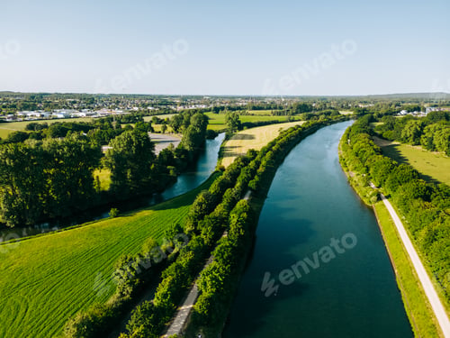 Preview: Summer aerial drone view landscape navigable river with bridges, agricultural fields
