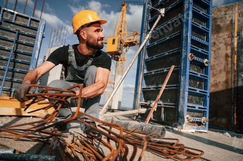 Preview: Preparatory works. Man in uniform is on the construction site