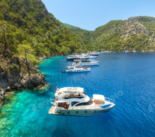 Preview: Aerial view of yachts and boats on the sea at sunset in summer