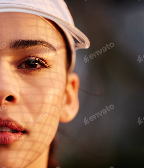 Preview: Closeup shot of a tennis player wearing a white visor