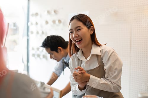 Preview: A barista showcasing enthusiasm while serving and interacting with customers