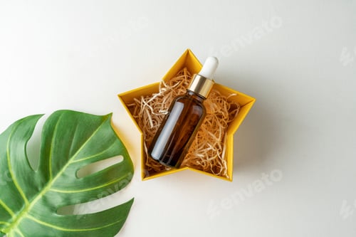 Vista previa: Un suero facial o aceite esencial en una caja de regalo para las fiestas
