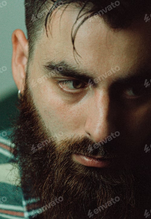 Preview: Young hipster man with a beard and a plaid shirt with shadows and copy space, portrait mental