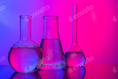 Preview: Chemical glassware close up on neon pink-purple background