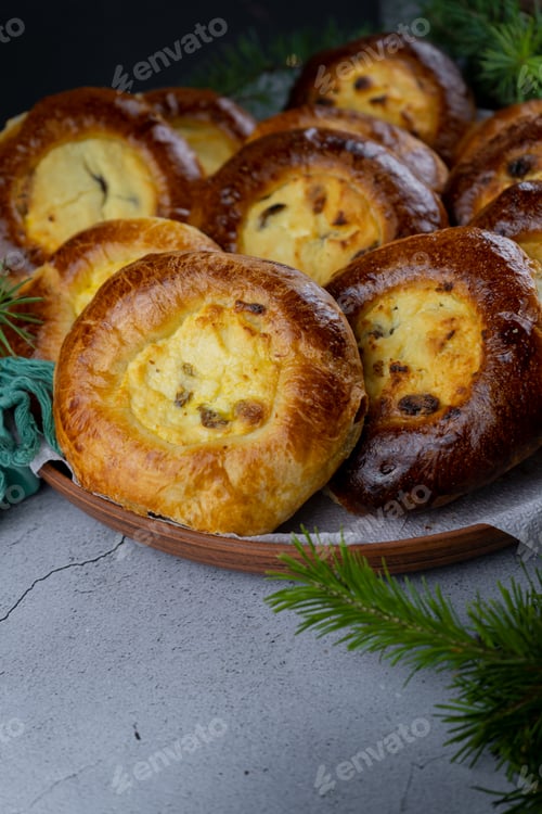 Preview: Traditional Russian baking pastry vatrushka, round buns, curd tart selective focus, closeup