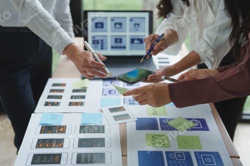 Preview: Web designers working on user experience and user interface of mobile application