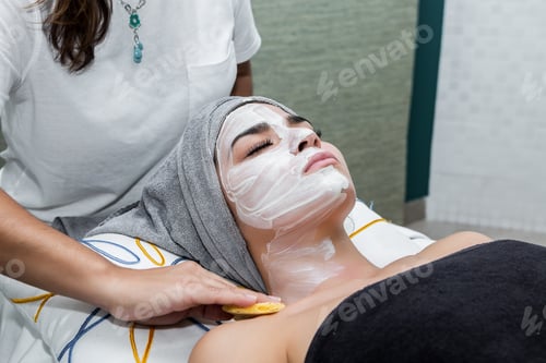 Preview: Woman removing mask from face of client