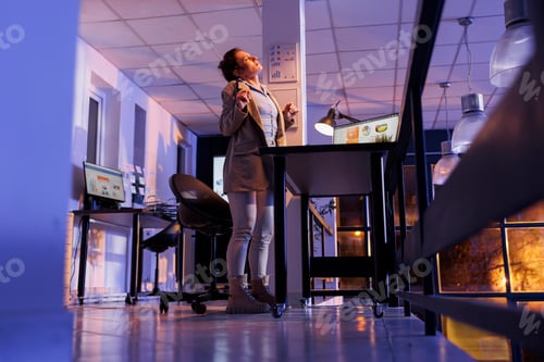 Preview: Tired manager stretching body for relaxing while working overtime