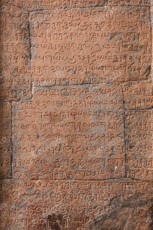 Preview: Ancient inscriptions stone wall in ancient Tamil language