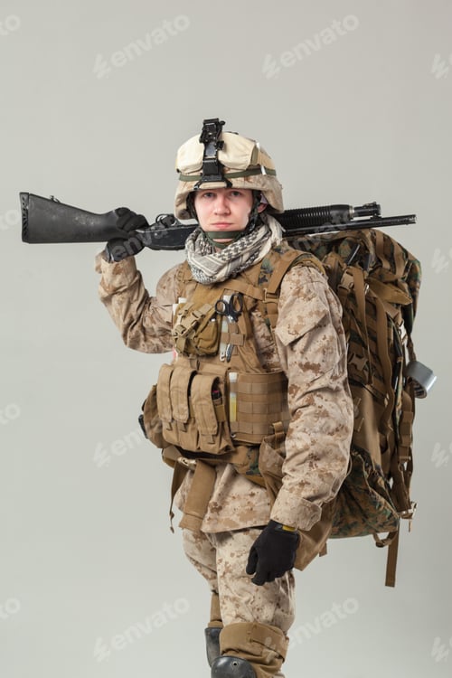Preview: Soldier prepares for mission with gear and rifle in a studio setting