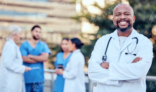 Preview: Shot of a mature male doctor standing with her arms crossed in the city