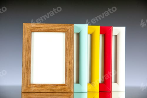 Preview: front view different picture frames with colored corners on light dark background picture family