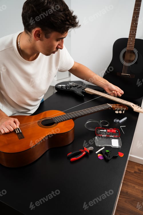 Preview: Installing replacement strings on acoustic guitar during maintenance