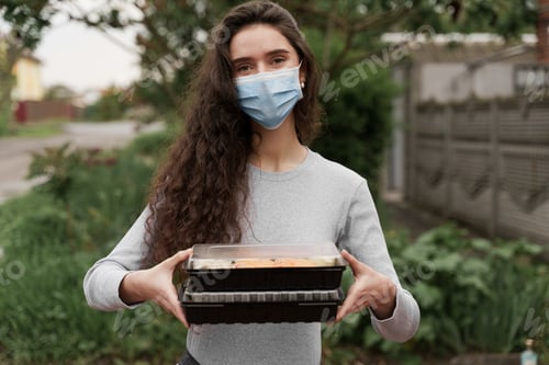 Preview: Girl with sushi boxes standing by delivery car