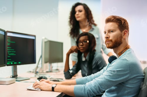Preview: Software engineers working on project and programming in company