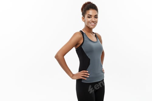 Preview: Healthy and Fitness concept - Beautiful American African lady in fitness clothes ready for workout