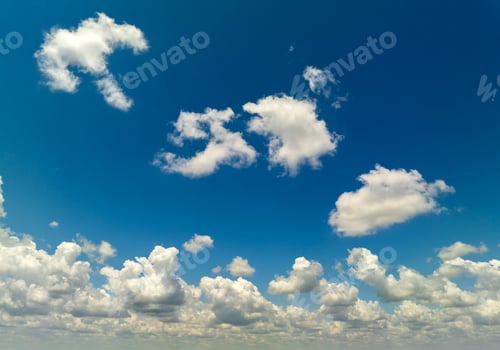 Preview: Bright landscape of blue sky with flying white clouds.