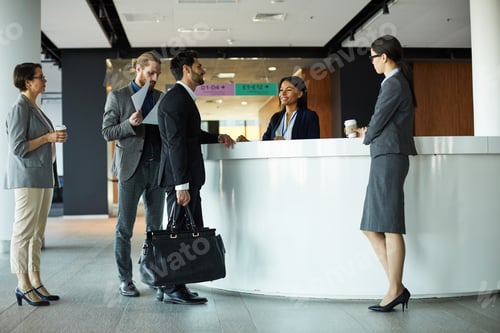 Preview: Businessman checking in to hotel
