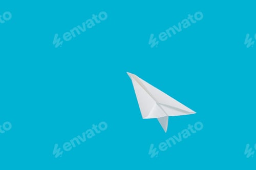 Preview: Image of an origami airplane with a long tail soaring in a bright blue sky