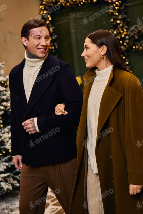 Preview: Joyful moments shared between a couple during a winter stroll in a festive setting