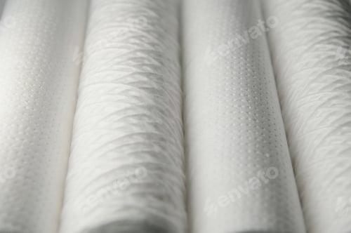 Preview: Cartridges for water treatment systems on white background.